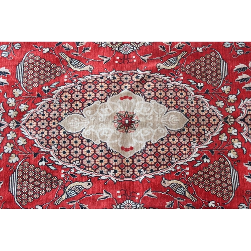216 - A superb quality hand made Persian silk decorative red ground rug, fine quality knot structure, appr... 
