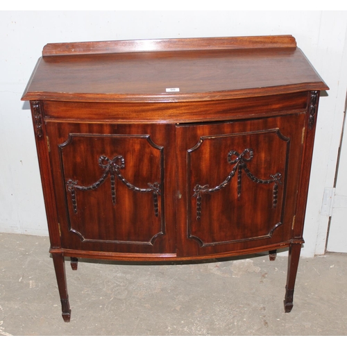 90 - Vintage mahogany cocktail cabinet with swag decoration and mirrored interior, approx 92cm wide x 42c... 