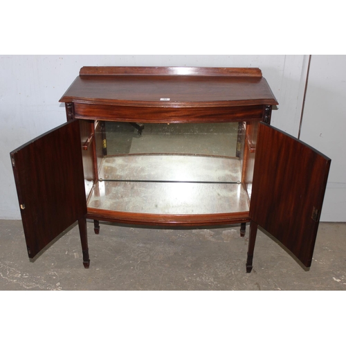 90 - Vintage mahogany cocktail cabinet with swag decoration and mirrored interior, approx 92cm wide x 42c... 