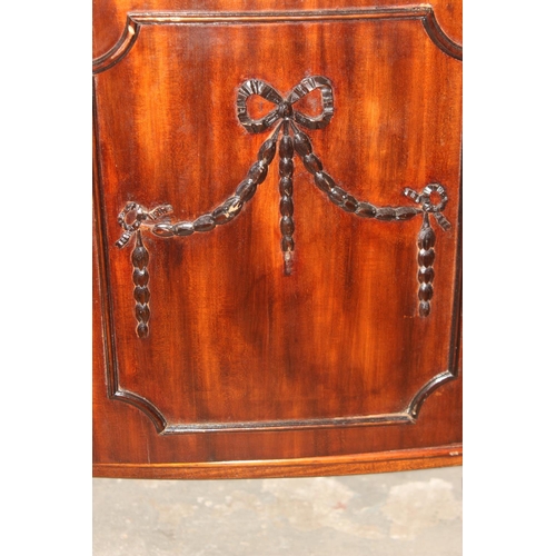 90 - Vintage mahogany cocktail cabinet with swag decoration and mirrored interior, approx 92cm wide x 42c... 