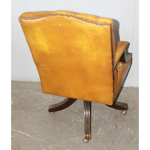 97 - A light brown Chesterfield button desk or captain's chair, approx 60cm wide x 56cm deep x 103cm tall