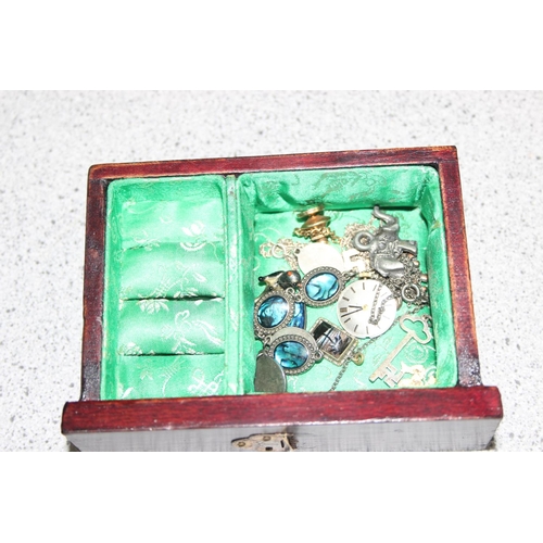 1154 - A Chinese wooden and jade mounted jewellery box and contents