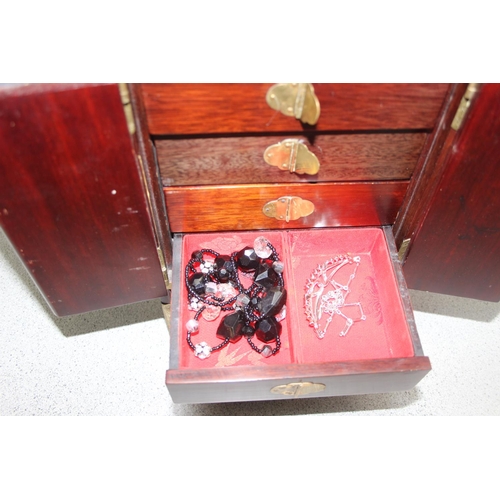 1162 - Oriental style wooden jewellery box with some contents to include silver, approx 21cm W x 15cm D x 3... 