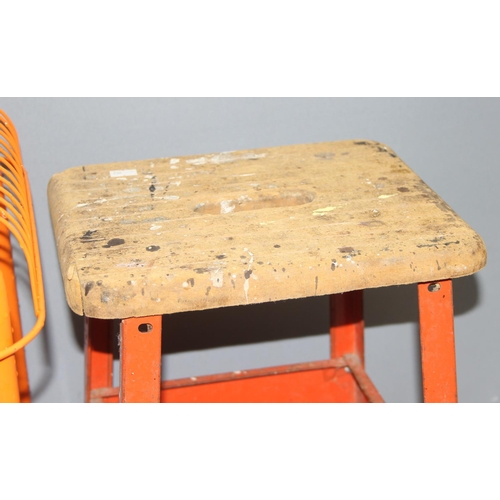 145 - Pair of Ikea Vasteron orange metal stools and a Hirsh metal work stool, approx 36cm W x 36cm D x 45c... 