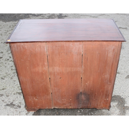 33 - A 19th century mahogany and Sheraton style satinwood inlaid kneehole desk with 8 drawers and a cupbo... 