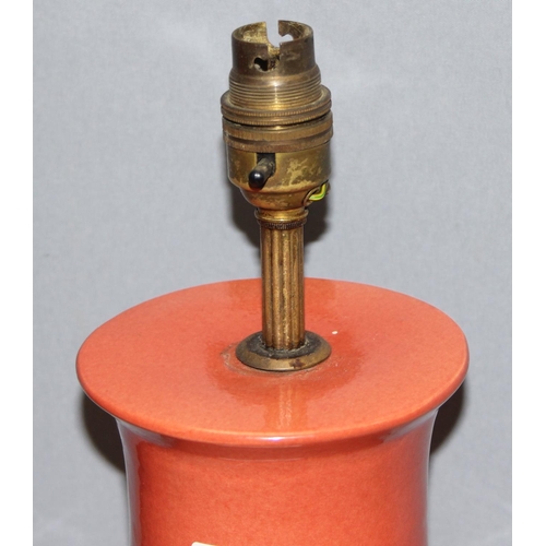 249 - Pair of Chinese style shaped pottery lamps on wooden base, in a orange/red terracotta colour, approx... 