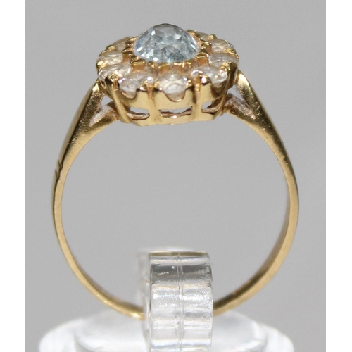 1156 - An 18ct gold white and light blue stone cluster ring, marked 750 & XRF confirmed, approx size P, app... 