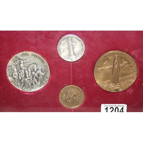 1204 - A set of 4 Santa Monica 1975 centennial commemorative medallions, 2 made from pure .999 silver and 2... 