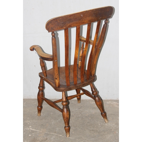 143 - A 19th century farmhouse slatback Windsor armchair with elm seat, approx 56cm wide x 65cm deep x 110... 