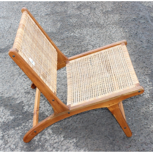 9 - A retro Scandinavian style wooden and rattan lounge chair, approx 65cm wide x 80cm deep x 70cm tall