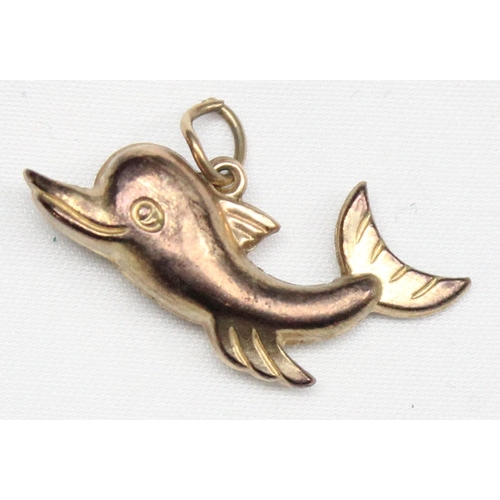 1166 - 9ct gold charm or pendant formed as a dolphin, marked and XRF confirmed, approx 1.11g gross