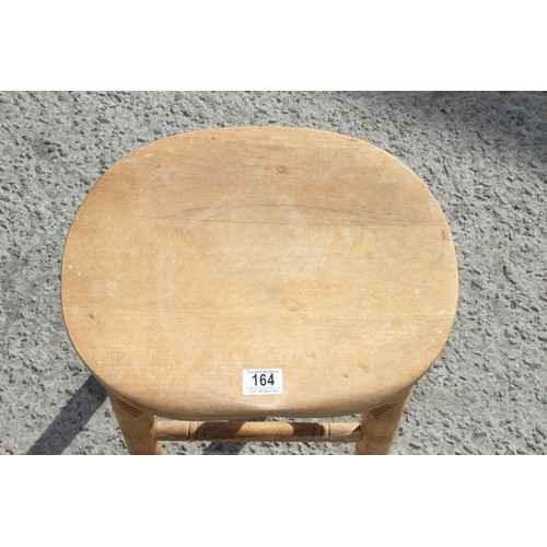 32 - A vintage heavy light wood stool with turned legs, approx 53cm tall