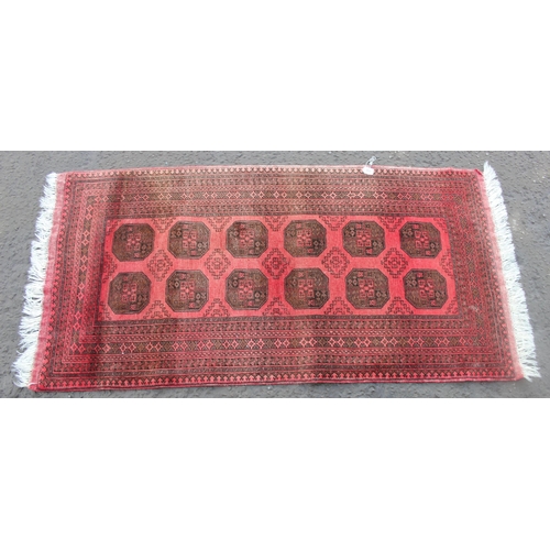 215 - Red ground rug, approx 214cm x 106cm