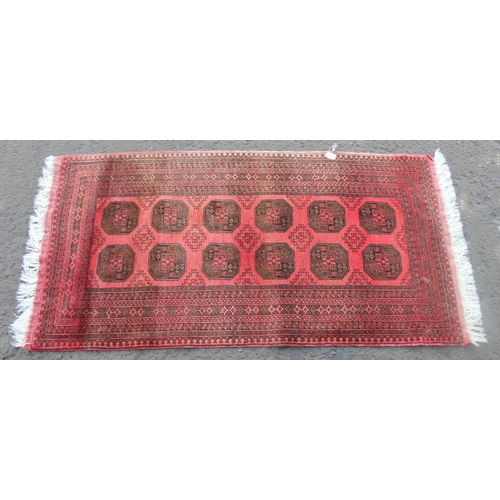 215 - Red ground rug, approx 214cm x 106cm