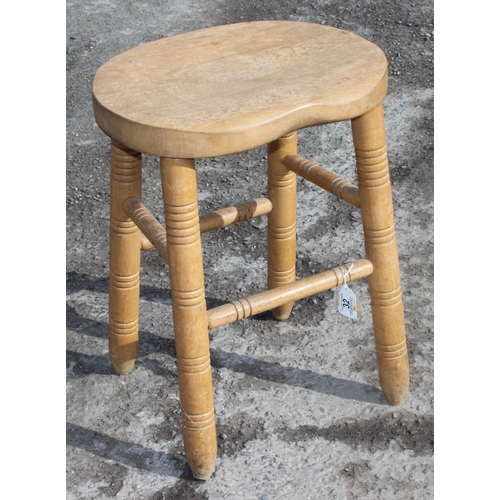 32 - A vintage heavy light wood stool with turned legs, approx 53cm tall