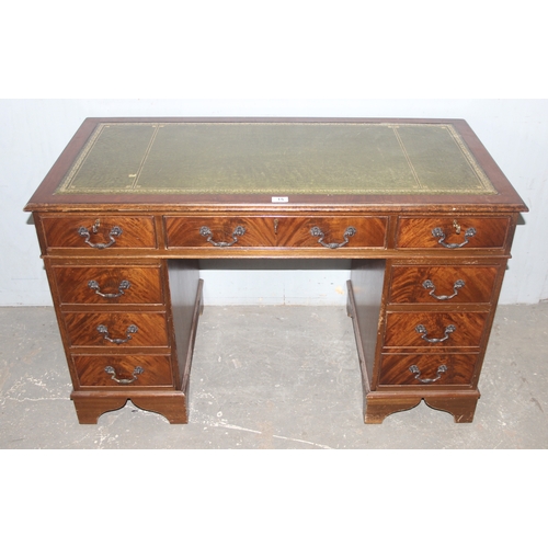 15 - A vintage mahogany pedestal desk with green gilt tooled leather top, approx 120cm wide x 60cm deep x... 