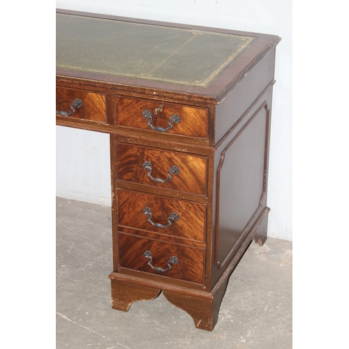 15 - A vintage mahogany pedestal desk with green gilt tooled leather top, approx 120cm wide x 60cm deep x... 