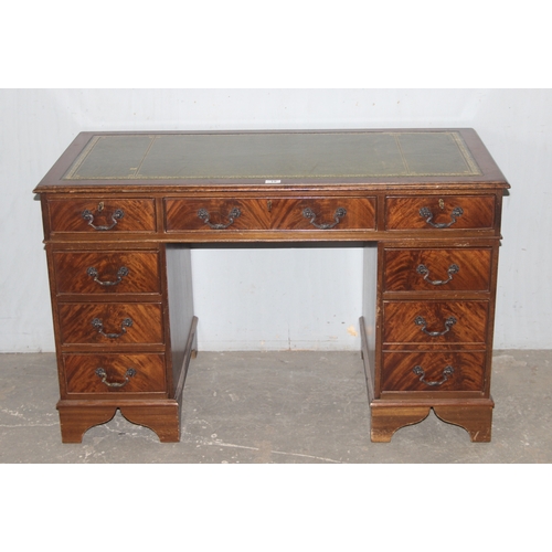 15 - A vintage mahogany pedestal desk with green gilt tooled leather top, approx 120cm wide x 60cm deep x... 