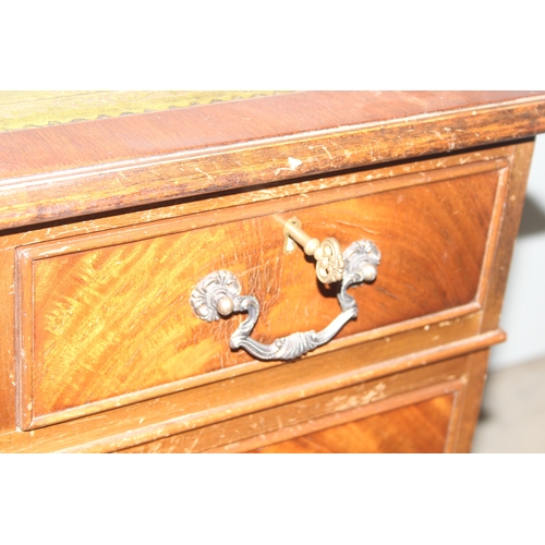 15 - A vintage mahogany pedestal desk with green gilt tooled leather top, approx 120cm wide x 60cm deep x... 