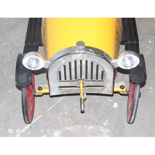 1500 - A vintage style metal child's pedal car, approx 110cm long, yellow painted like Brum