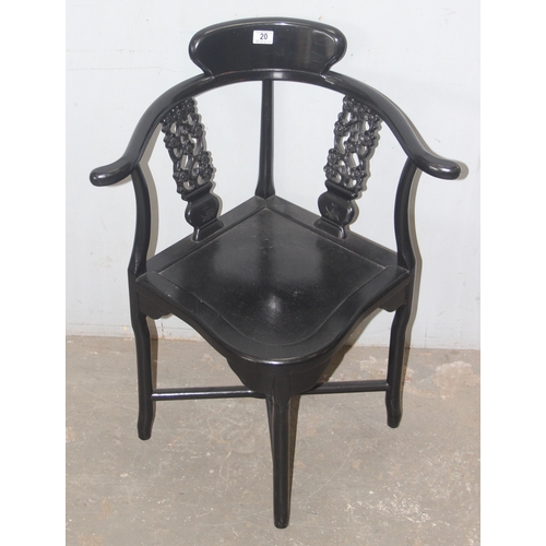 20 - A black painted Chinese designed corner chair with carved slats, approx 66cm wide x 83cm tall