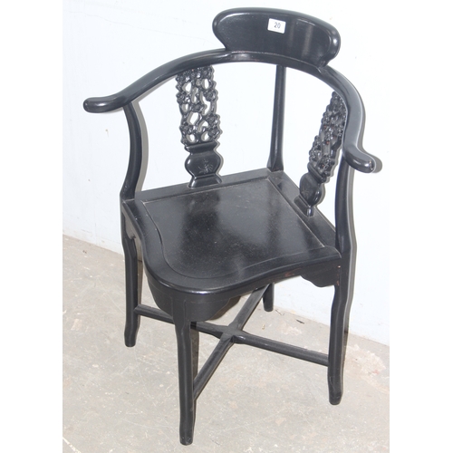 20 - A black painted Chinese designed corner chair with carved slats, approx 66cm wide x 83cm tall