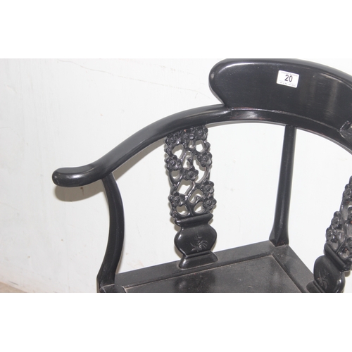 20 - A black painted Chinese designed corner chair with carved slats, approx 66cm wide x 83cm tall