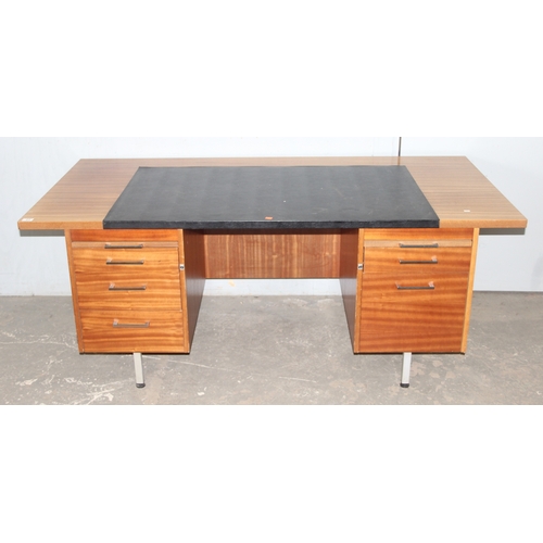 23 - A large retro Abbess desk, 2 banks of drawers with black leather top and metal legs, approx 183cm wi... 