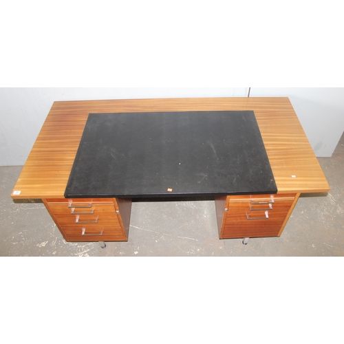 23 - A large retro Abbess desk, 2 banks of drawers with black leather top and metal legs, approx 183cm wi... 