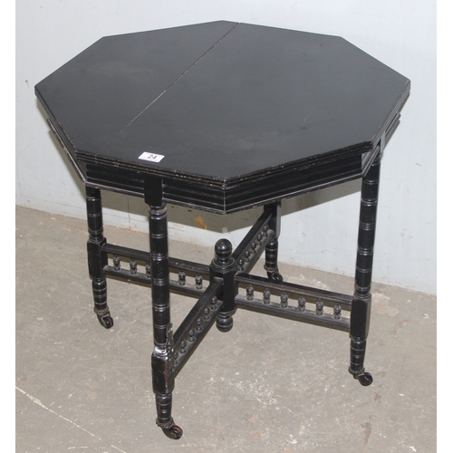 24 - A black painted octagonal side table, approx 67cm wide x 67cm tall