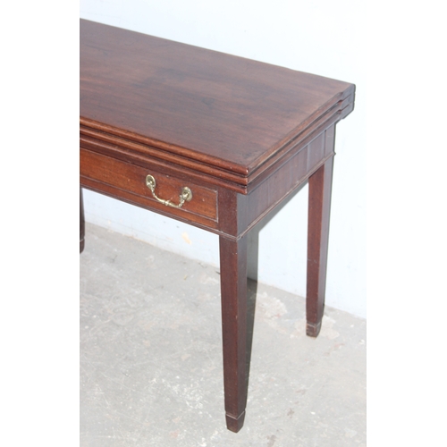 29 - An unusual 19th century fold over topped tea and card table with elaborate double hinge, approx 91cm... 