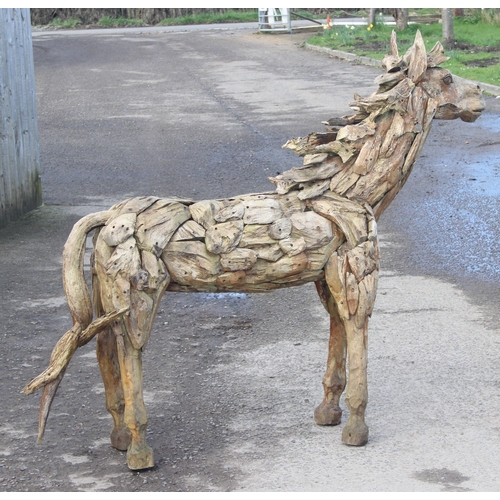 300 - In the manner of Heather Jansch (British 1948-2021), a near life size wooden garden sculpture or fig... 