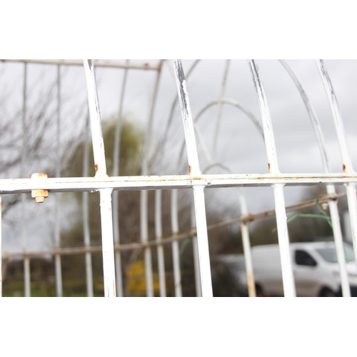 301 - A vintage white painted wrought iron garden arbour seat, approx 156cm wide x 50cm deep x 235cm tall