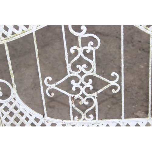 303 - A vintage white painted French style iron garden bench, approx 140cm wide x 105cm tall