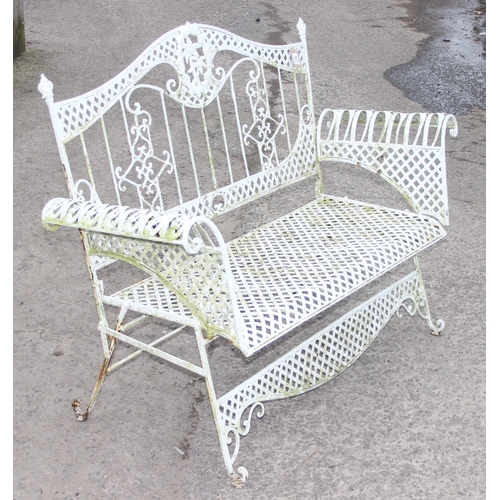 303 - A vintage white painted French style iron garden bench, approx 140cm wide x 105cm tall