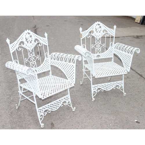 304 - A pair of vintage white painted French style iron garden chairs, each approx 80cm wide x 104cm tall