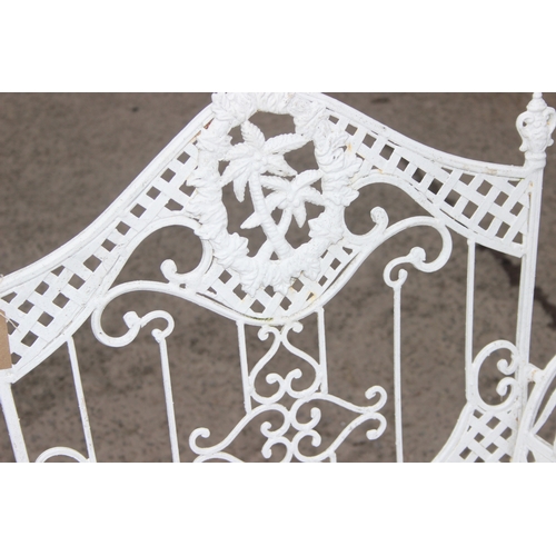 304 - A pair of vintage white painted French style iron garden chairs, each approx 80cm wide x 104cm tall