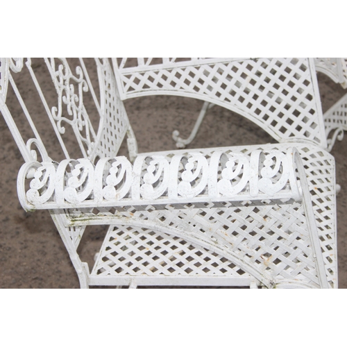 304 - A pair of vintage white painted French style iron garden chairs, each approx 80cm wide x 104cm tall