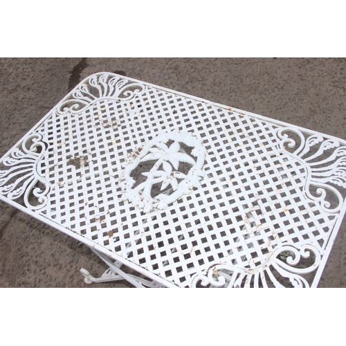 305 - A vintage white painted French style iron garden table, approx 85cm wide x 53cm deep x 60cm tall