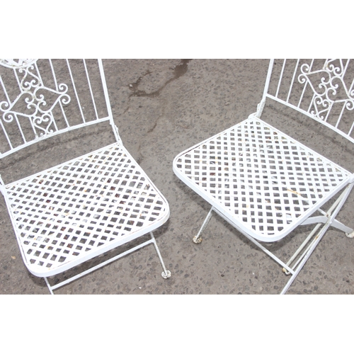 307 - A pair of vintage white painted metal garden chairs, each approx 92cm tall