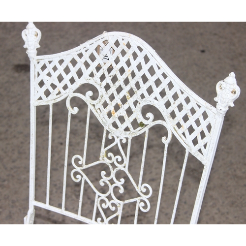 307 - A pair of vintage white painted metal garden chairs, each approx 92cm tall