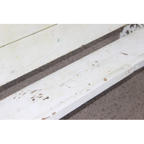 308 - A long white painted wooden and cast iron garden bench, approx 200cm wide x 63cm deep x 73cm tall