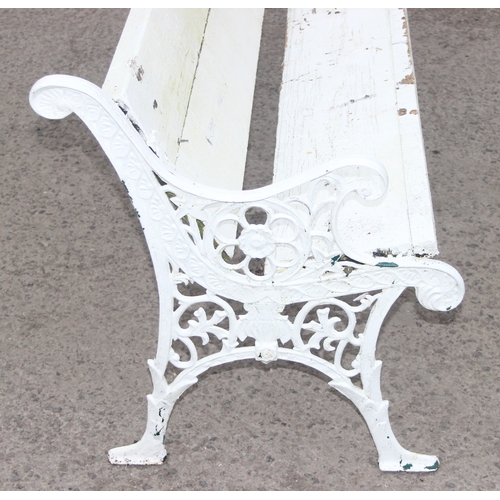 308 - A long white painted wooden and cast iron garden bench, approx 200cm wide x 63cm deep x 73cm tall