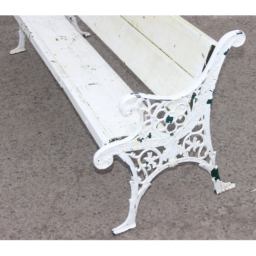 308 - A long white painted wooden and cast iron garden bench, approx 200cm wide x 63cm deep x 73cm tall