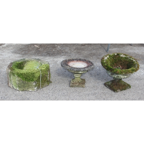 337 - A mossy concrete plinth and 2 weathered and mossy concrete urns (3)