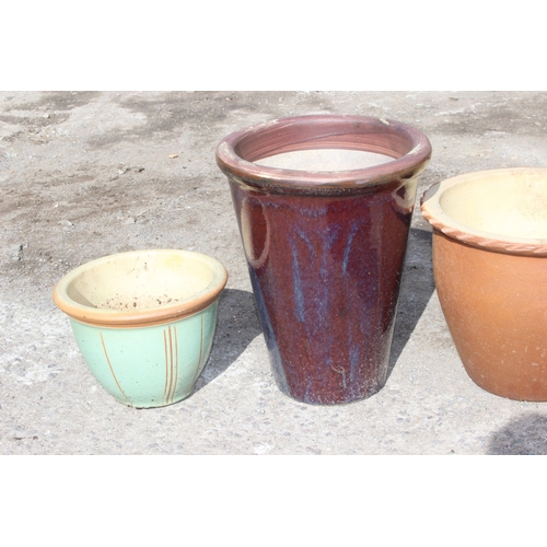 356 - 4 assorted glazed garden plant pots, largest approx 35cm wide x 35cm deep x 44cm tall