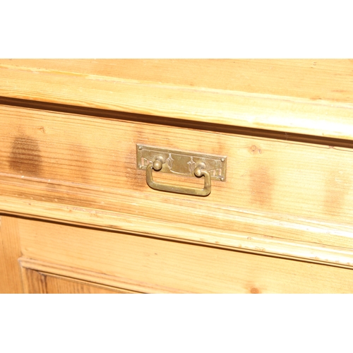 38 - A large Continental antique pine dresser, 2 drawers over 2 cupboards to base with 2 drawer glazed to... 