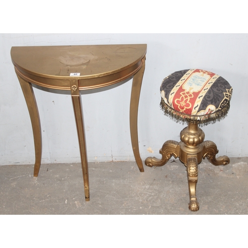 40 - A gold painted demilune table and a gold painted upholstered piano stool, the table approx 60cm wide