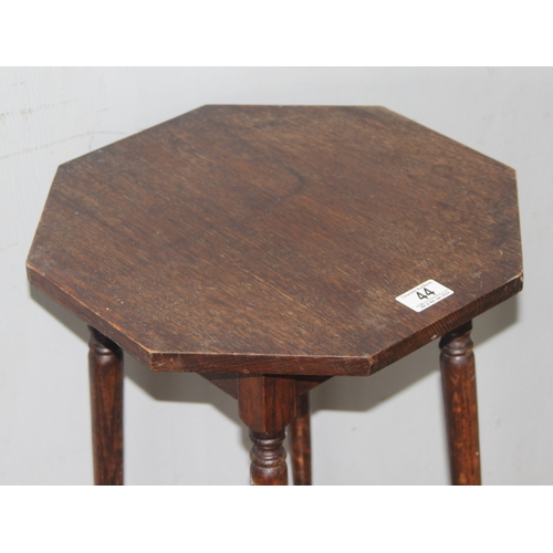 44 - A small vintage oak side table with octagonal top, approx 39cm wide x 39cm deep x 73cm tall