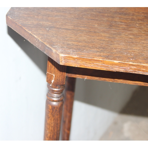 44 - A small vintage oak side table with octagonal top, approx 39cm wide x 39cm deep x 73cm tall